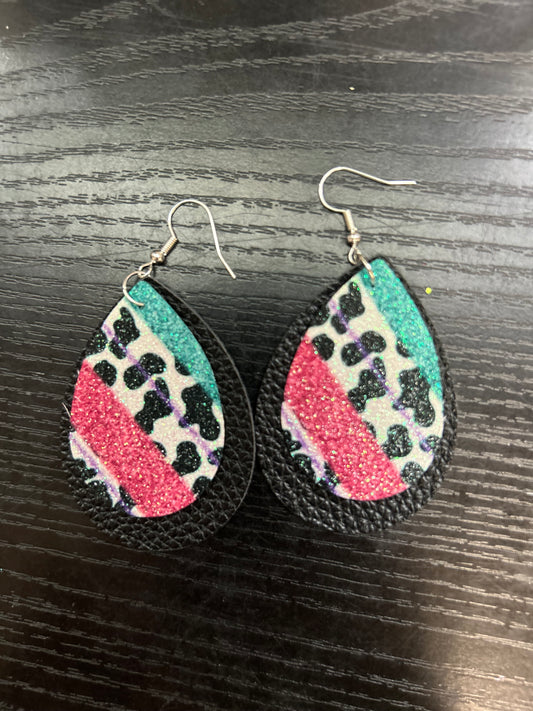 Cow print with pink/teal on black