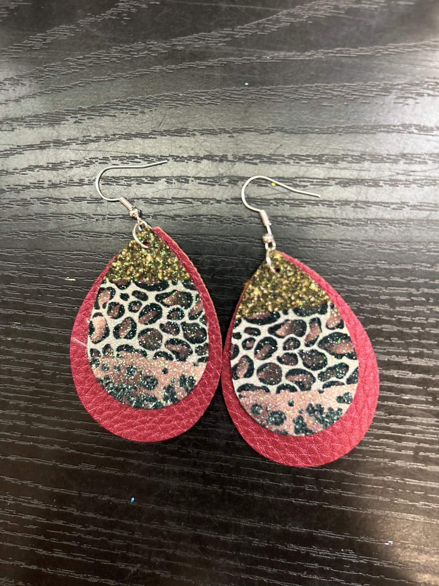Pink and gold cheetah on burgundy
