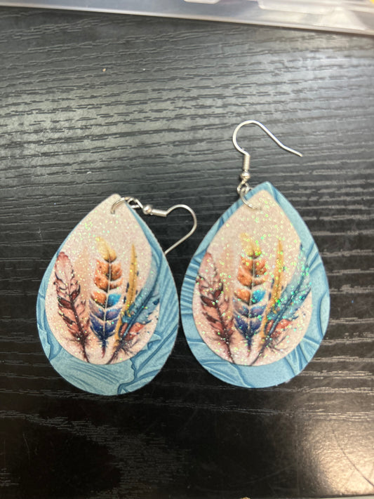 Feathers on tooled blue