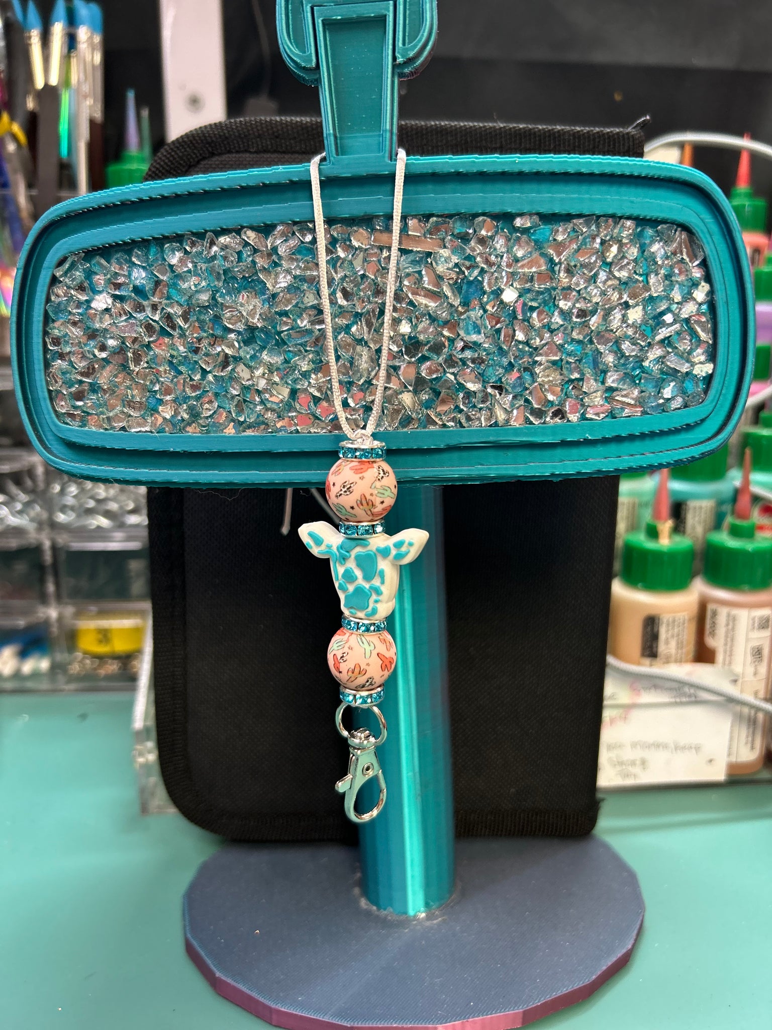 Teal calf/cactus hanger
